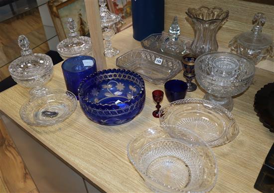 A collection of cut glass lidded dishes, a celery vase and overlaid bowl, etc.